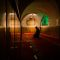 pexels photo 11119759 11119759 A man kneels in deep prayer inside a dimly lit mosque with arched ceilings and ornate carpet.
