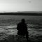pexels photo 28780571 28780571 A man watches the tranquil waters at twilight in Çanakkale, Türkiye.