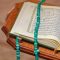 pexels photo 31035062 31035062 An open Quran with turquoise prayer beads rests elegantly on a carved wooden stand, symbolizing Islamic spirituality.